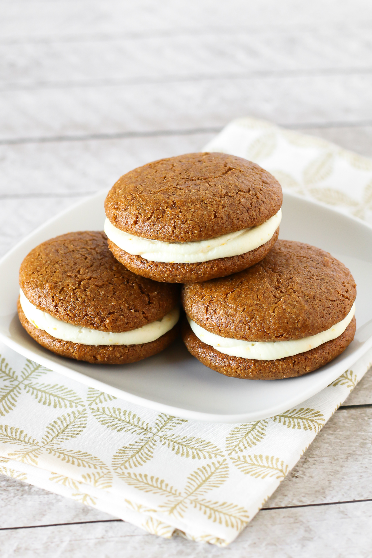 Gluten Free Vegan Gingerbread Whoopie Pies. Soft cake-like gingerbread cookies with a dairy free orange buttercream filling. Heavenly!