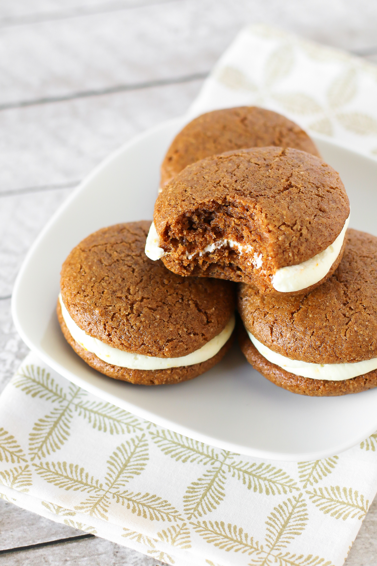 Gluten Free Vegan Gingerbread Whoopie Pies. Soft cake-like gingerbread cookies with a dairy free orange buttercream filling. Heavenly!