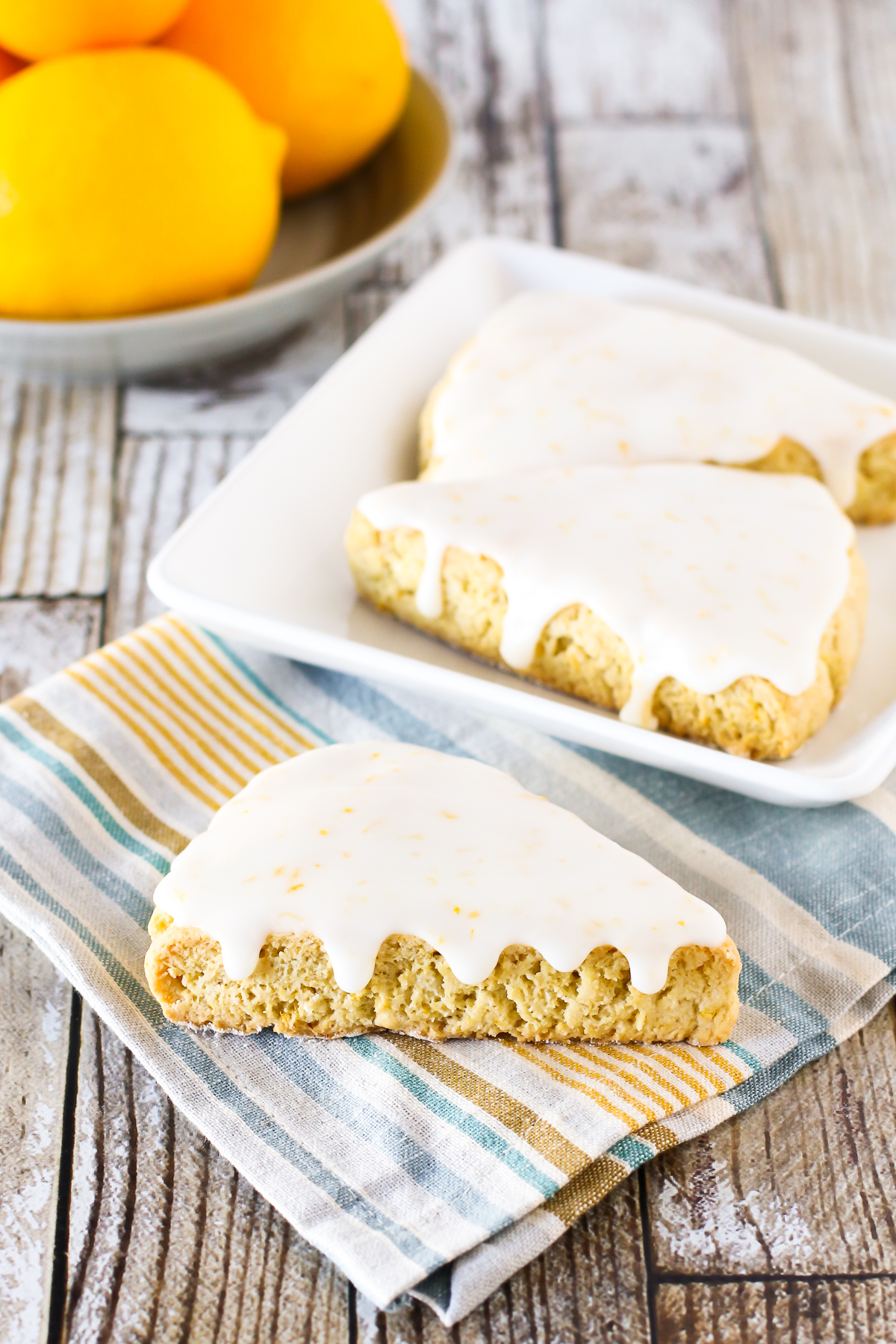 Gluten Free Vegan Glazed Lemon Scones. Soft, crumbly scones with a zesty lemon glaze. A simply irresistible morning treat.