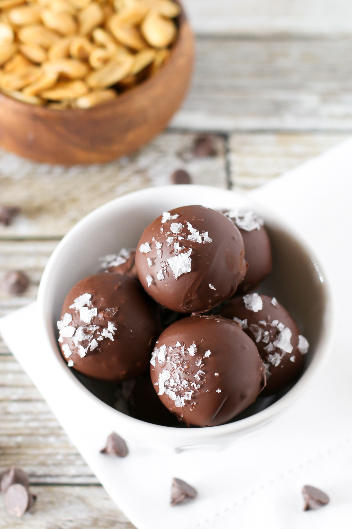 Gluten Free Vegan Salted Chocolate Peanut Butter Truffles. 3-ingredient creamy peanut butter truffles, coated in chocolate and a sprinkling of sea salt flakes. 