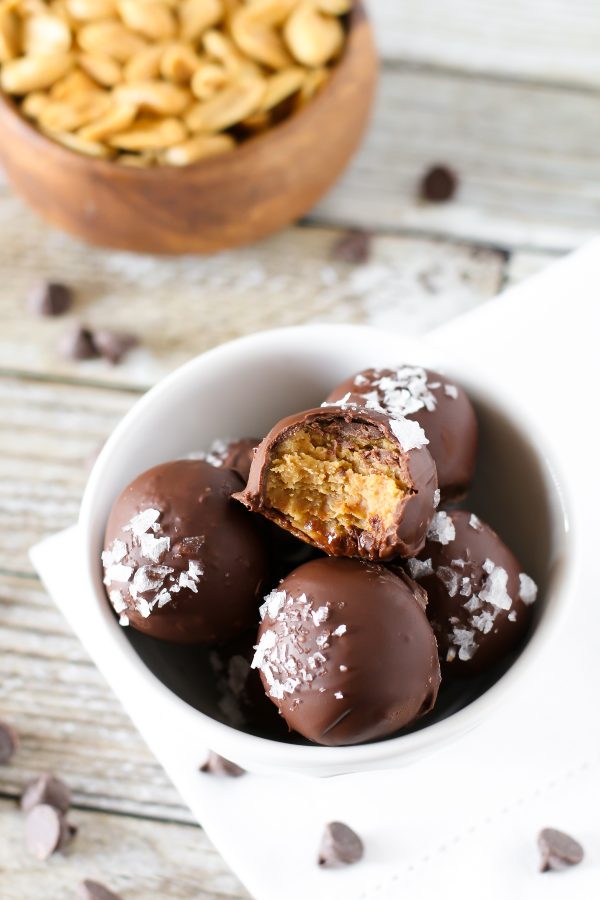 Gluten Free Vegan Salted Chocolate Peanut Butter Truffles. 3-ingredient creamy peanut butter truffles, coated in chocolate and a sprinkling of sea salt flakes.