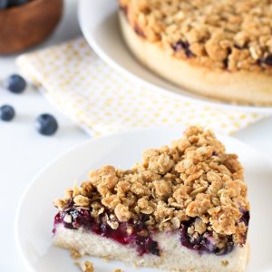 Gluten Free Vegan Blueberry Coffee Cake. Light vanilla cake with a layer of fresh, juicy blueberries and an oat crumb topping.