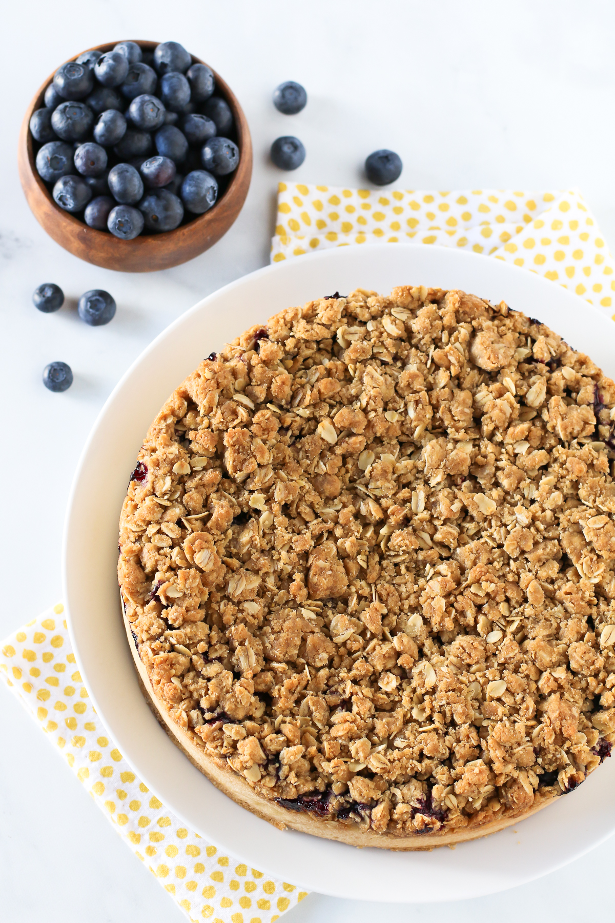 Gluten Free Vegan Blueberry Coffee Cake. Light vanilla cake with a layer of fresh, juicy blueberries and an oat crumb topping.