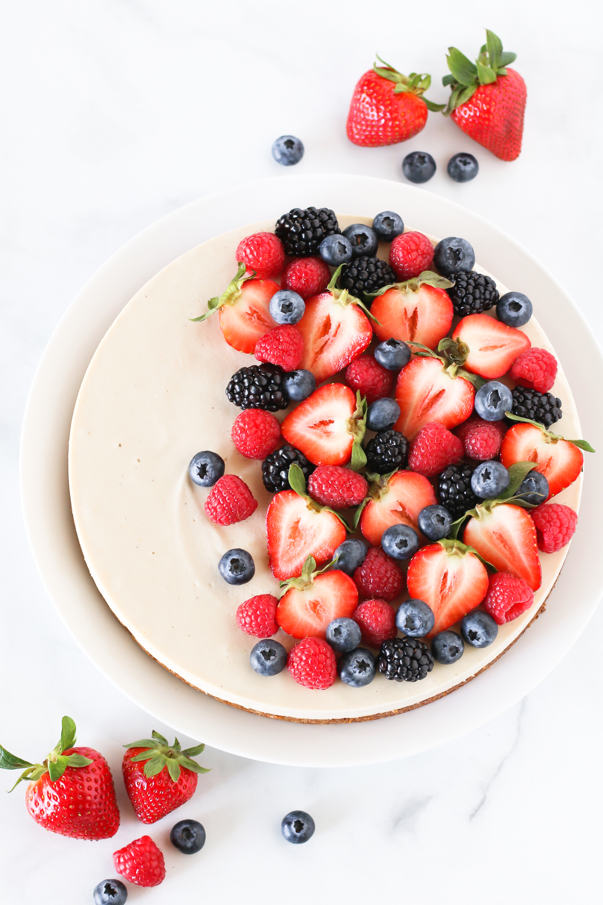 Gluten Free Vegan Berry Cheesecake. You will go head over heals for this dairy free cheesecake! Made with cashews, the creamy texture is perfectly paired with the fresh berries.