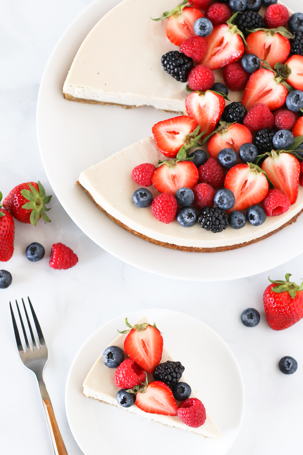 Gluten Free Vegan Berry Cheesecake. You will go head over heals for this dairy free cheesecake! Made with cashews, the creamy texture is perfectly paired with the fresh berries.