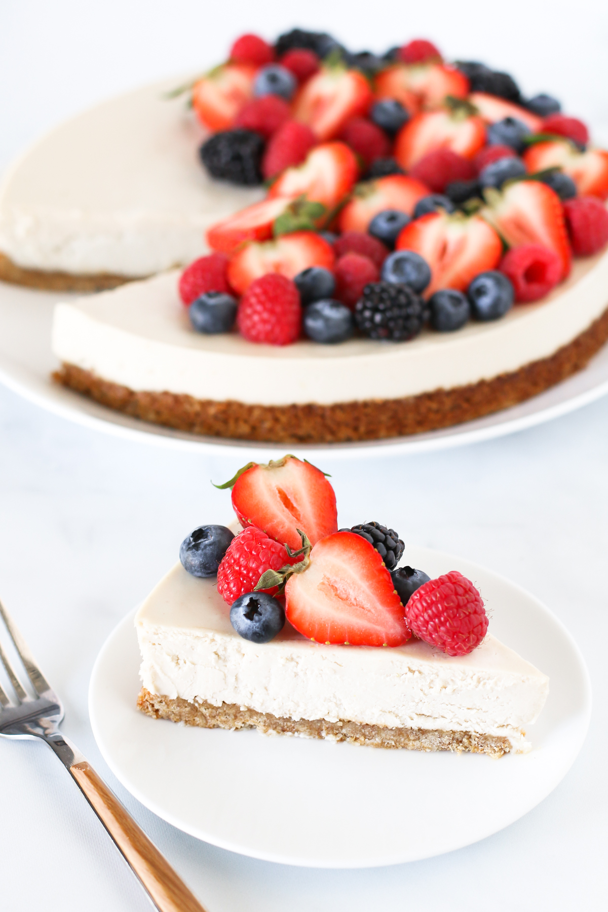 Gluten Free Vegan Berry Cheesecake. You will go head over heals for this dairy free cheesecake! Made with cashews, the creamy texture is perfectly paired with the fresh berries.