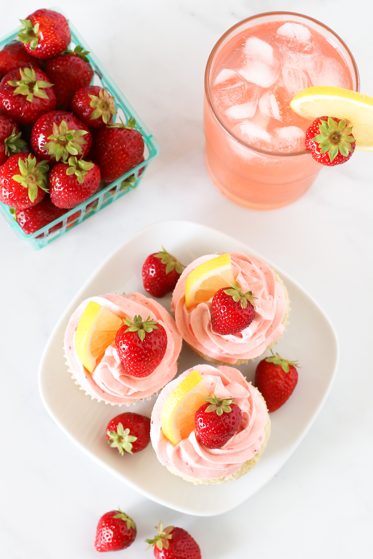 Gluten Free Vegan Strawberry Lemonade Cupcakes. Light, fluffy lemon cupcakes with a fresh strawberry buttercream. Tastes like summer!