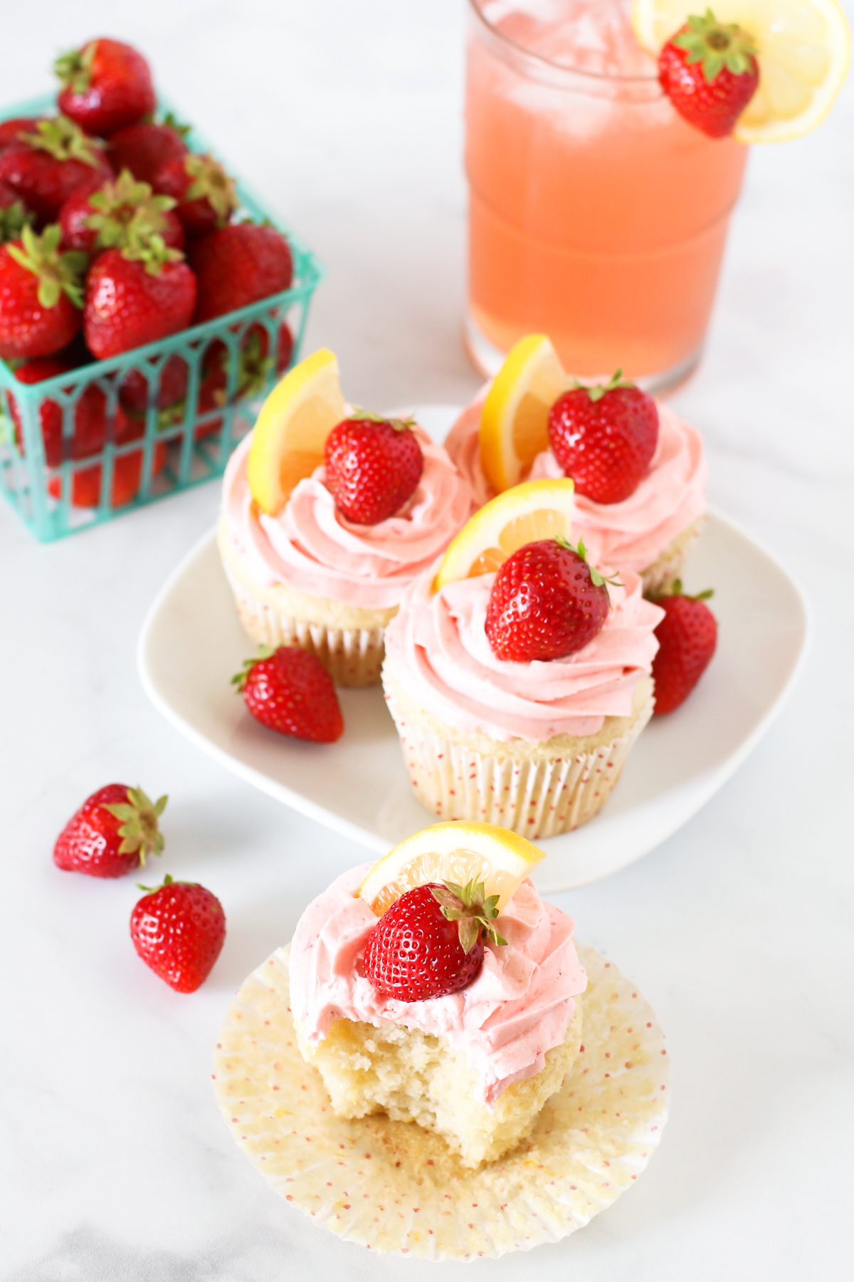 Gluten Free Vegan Strawberry Lemonade Cupcakes. Light, fluffy lemon cupcakes with a fresh strawberry buttercream. It’s like a bite into summer!