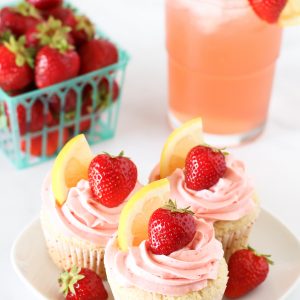 Gluten Free Vegan Strawberry Lemonade Cupcakes. Light, fluffy lemon cupcakes with a fresh strawberry buttercream. Tastes like summer!