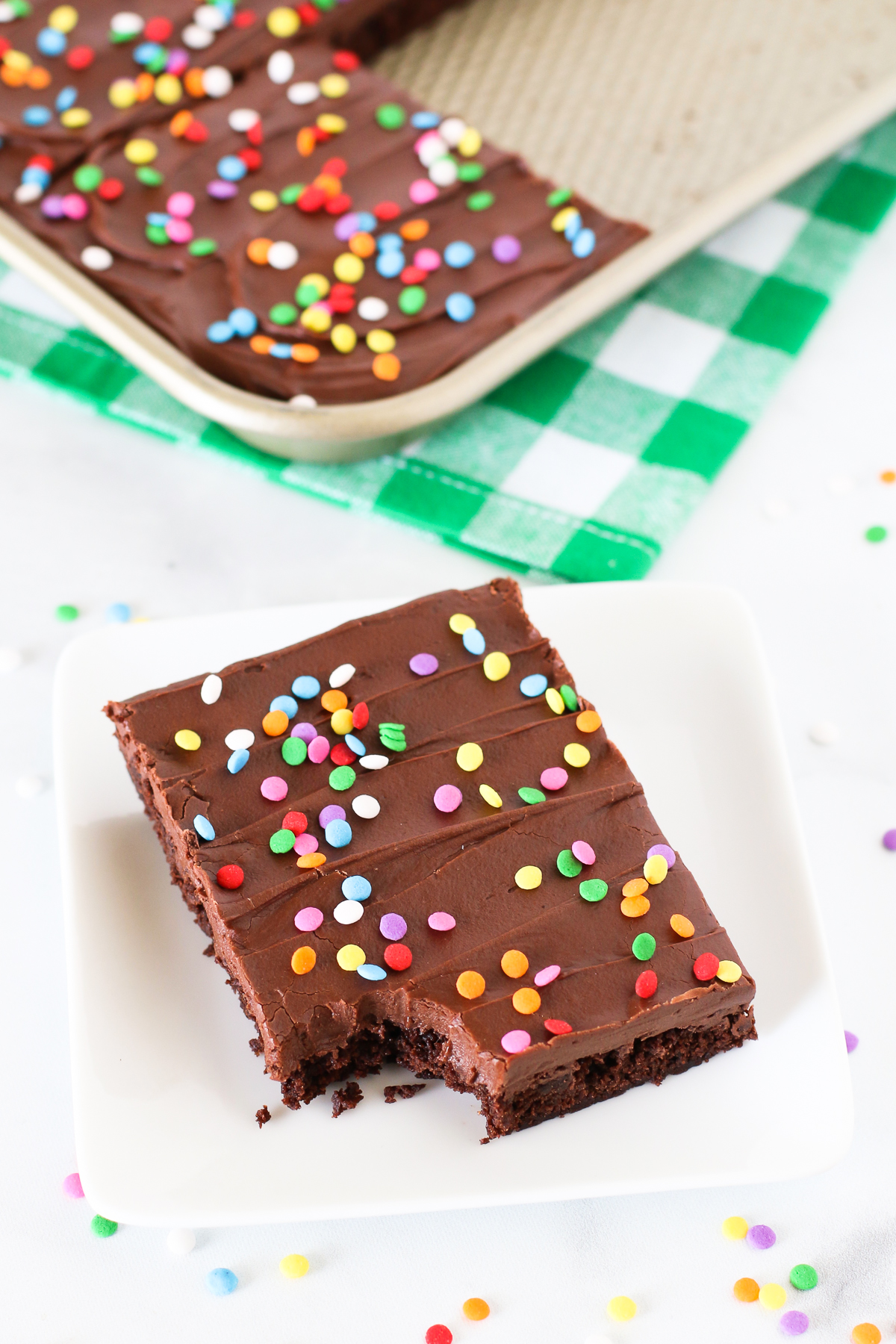 Gluten Free Vegan Chocolate Frosted Brownies. What could be better than a fudgy, chocolate frosted brownie with colorful sprinkles?