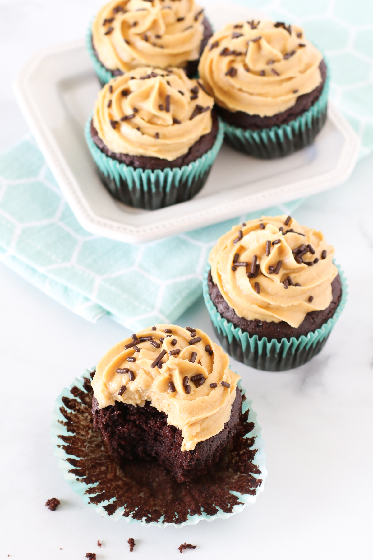 Gluten Free Vegan Chocolate Peanut Butter Cupcakes. Fluffy chocolate cupcakes with a creamy, dreamy peanut butter frosting. 
