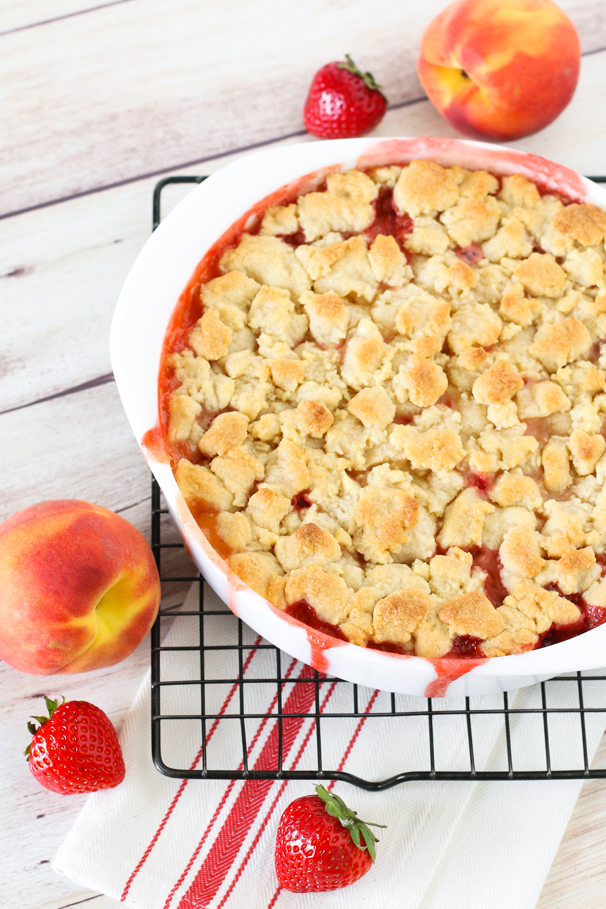 Grain Free Vegan Strawberry Peach Crisp. Golden grain free crisp topping over sweet, juicy strawberries and peaches. A summertime must! 