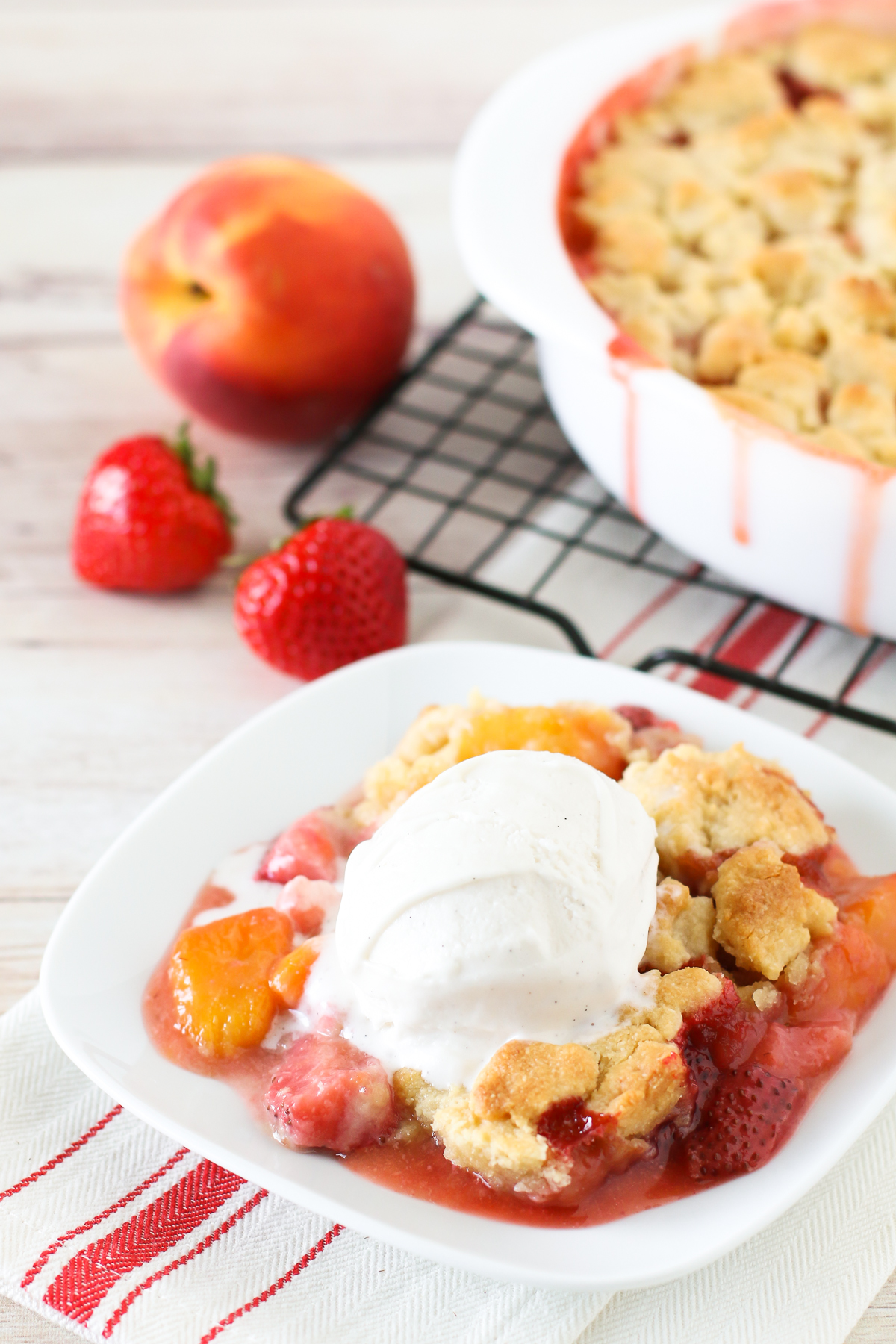 Grain Free Vegan Strawberry Peach Crisp. Golden grain free crisp topping over sweet, juicy strawberries and peaches. 