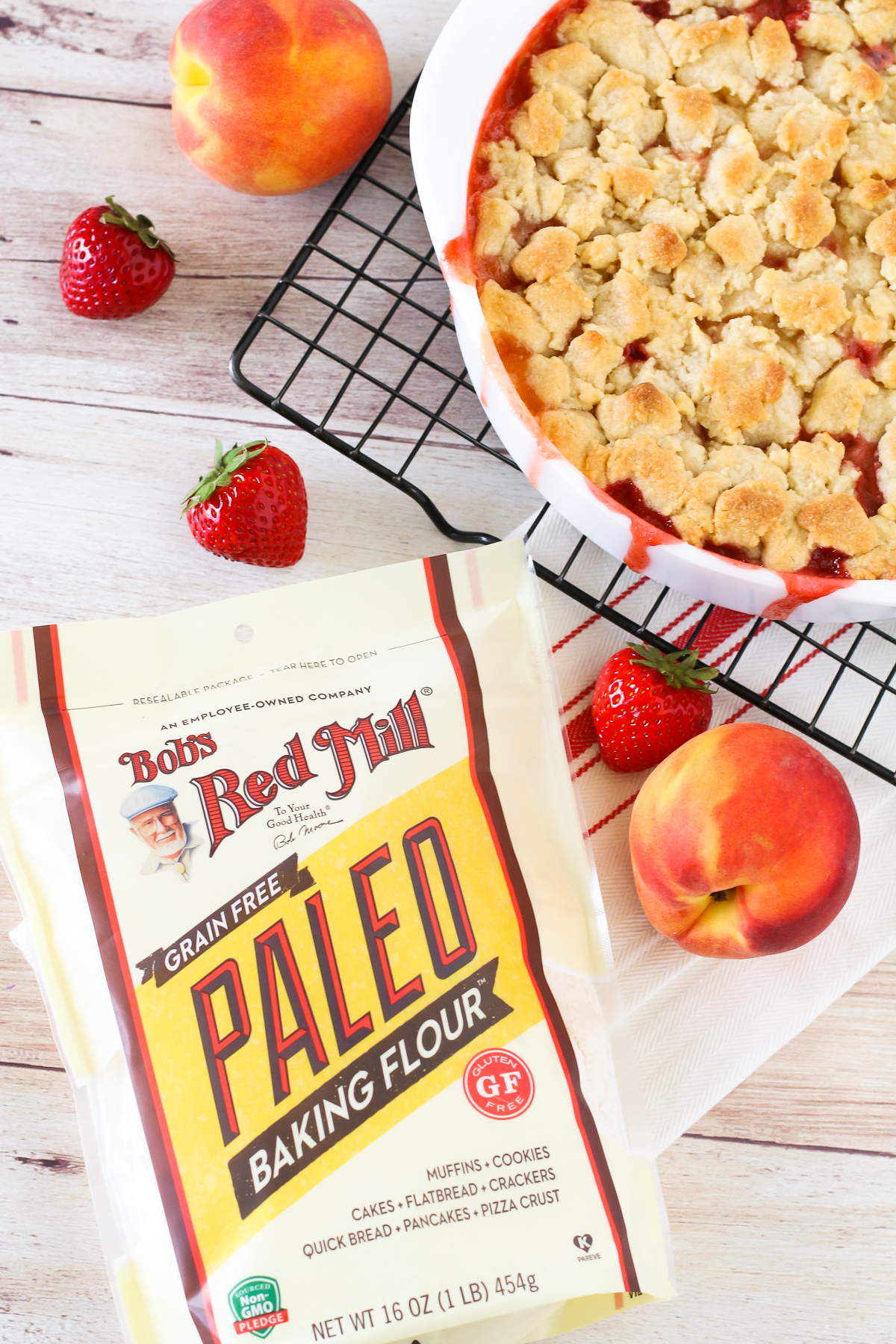 Grain Free Vegan Strawberry Peach Crisp. Golden grain free crisp topping, made with Bob’s Red Mill Paleo Baking Flour. The combo of sweet, juicy strawberries and peaches makes this a summertime must!