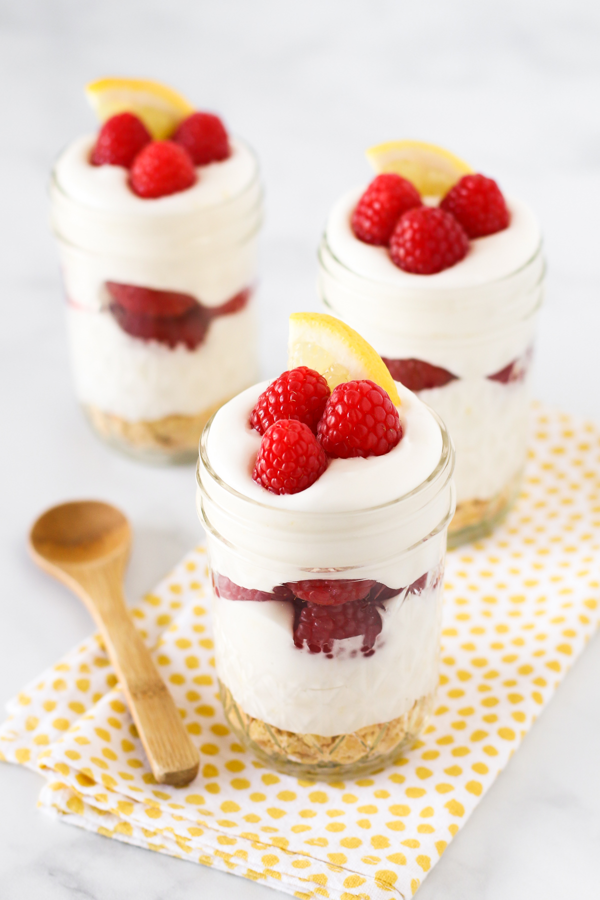 Gluten Free Vegan Raspberry Lemon Cream Parfaits. Layers of light, dairy free lemon cream and fresh, sweet raspberries.