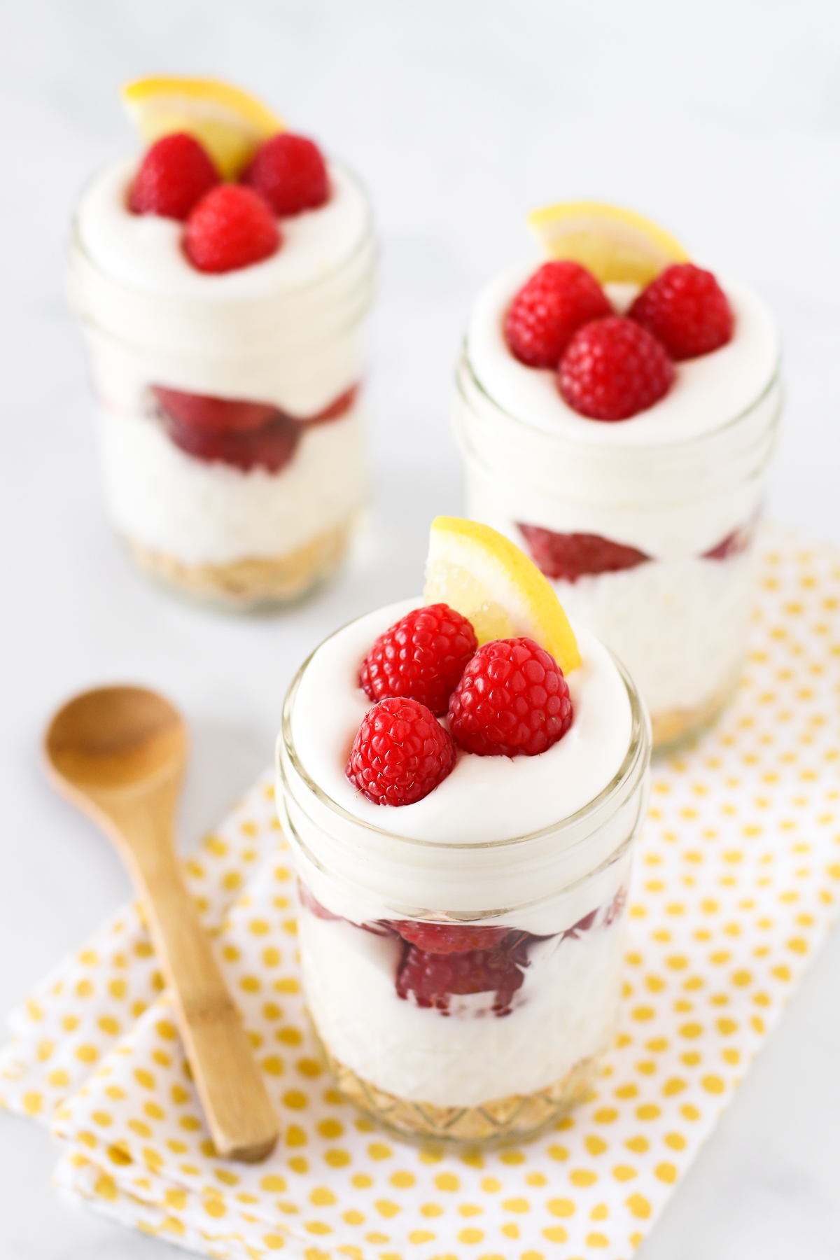 Gluten Free Vegan Raspberry Lemon Cream Parfaits. Layers of light, dairy free lemon cream and fresh, sweet raspberries. 