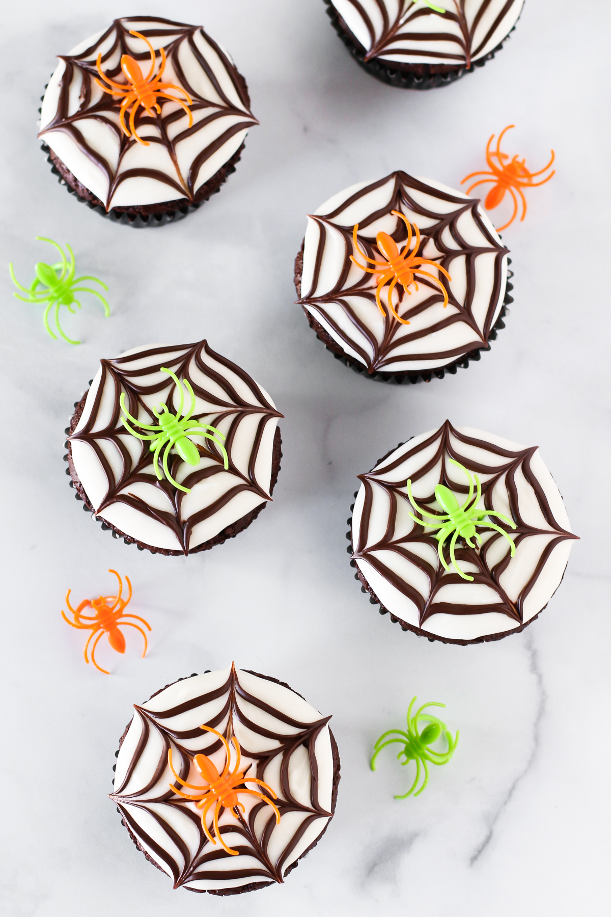 Gluten Free Vegan Chocolate Spiderweb Cookies. These easy-peasy, creepy spiderweb cupcakes are sure to be a hit at your Halloween party this year!