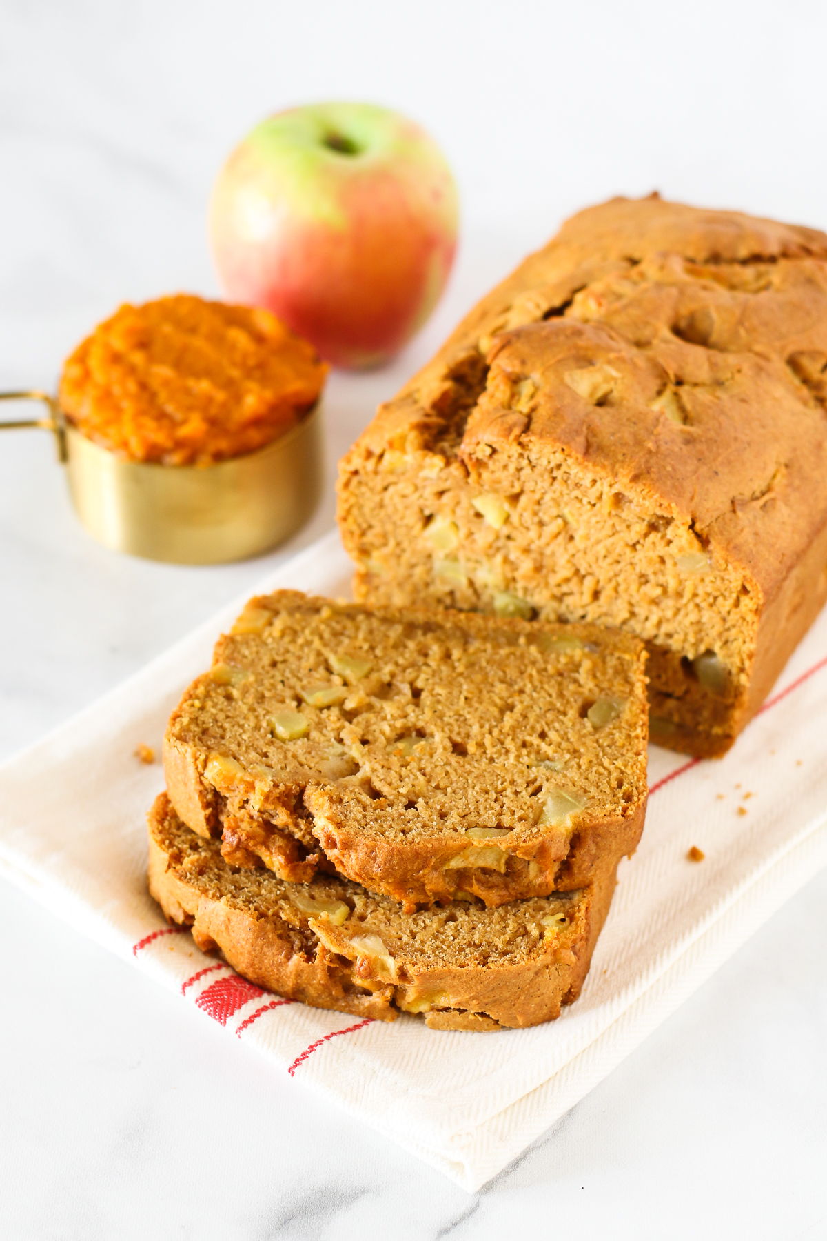 Gluten Free Vegan Pumpkin Apple Bread. Thick slices of pumpkin bread, loaded with fresh apples. A lovely fall treat.