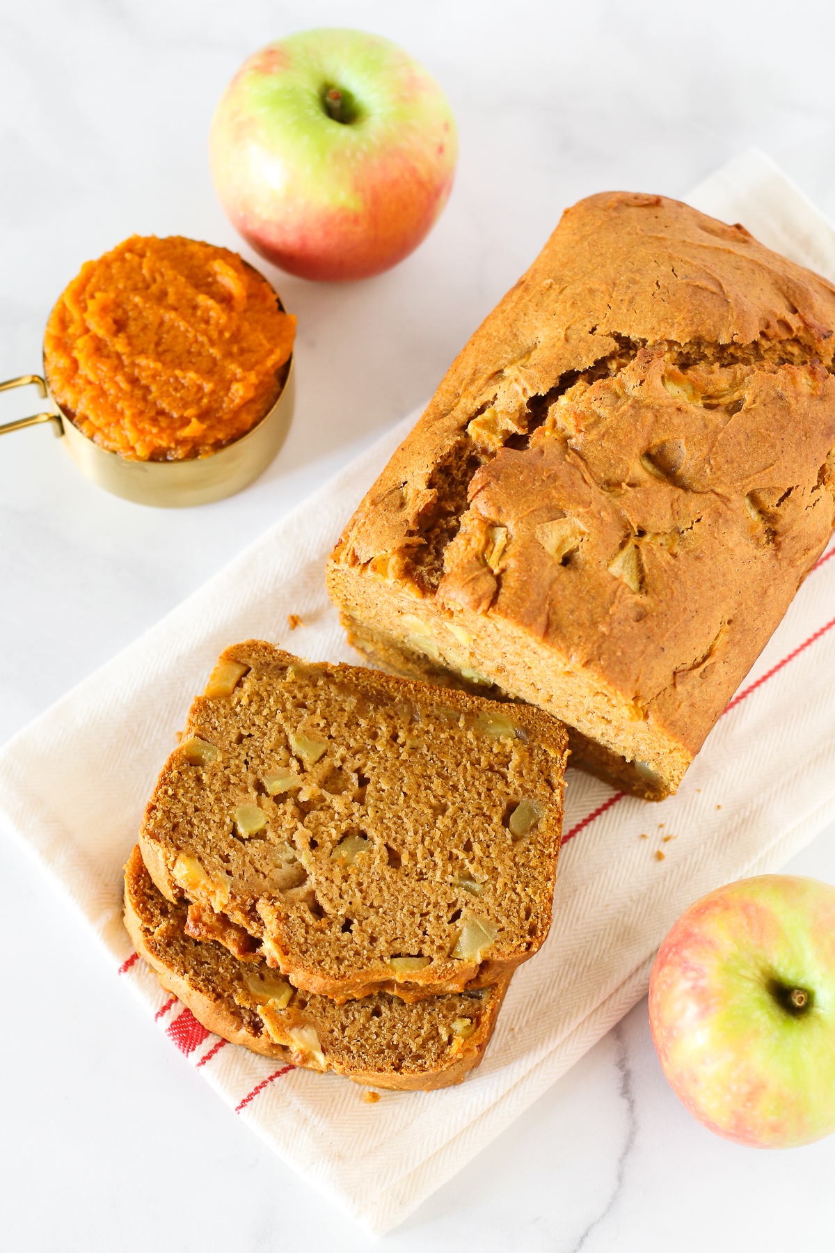 Gluten Free Vegan Pumpkin Apple Bread. Thick slices of pumpkin bread, loaded with fresh apples. A lovely fall treat.