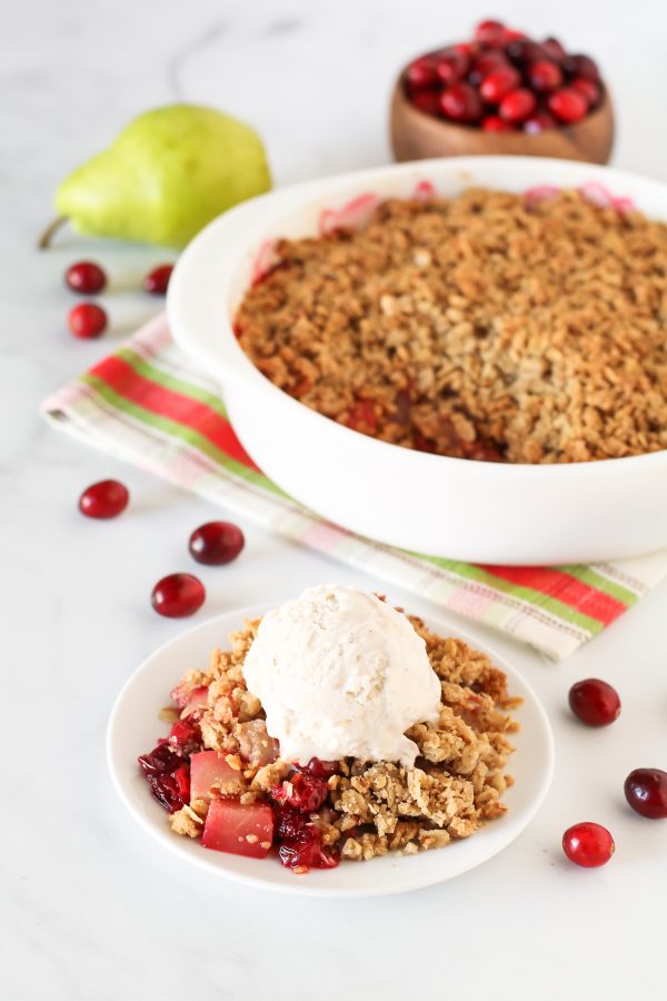 Gluten Free Vegan Cranberry Pear Crisp. Tender pears, tart cranberries and a golden oat-pecan crumb topping. A scrumptious holiday dessert!