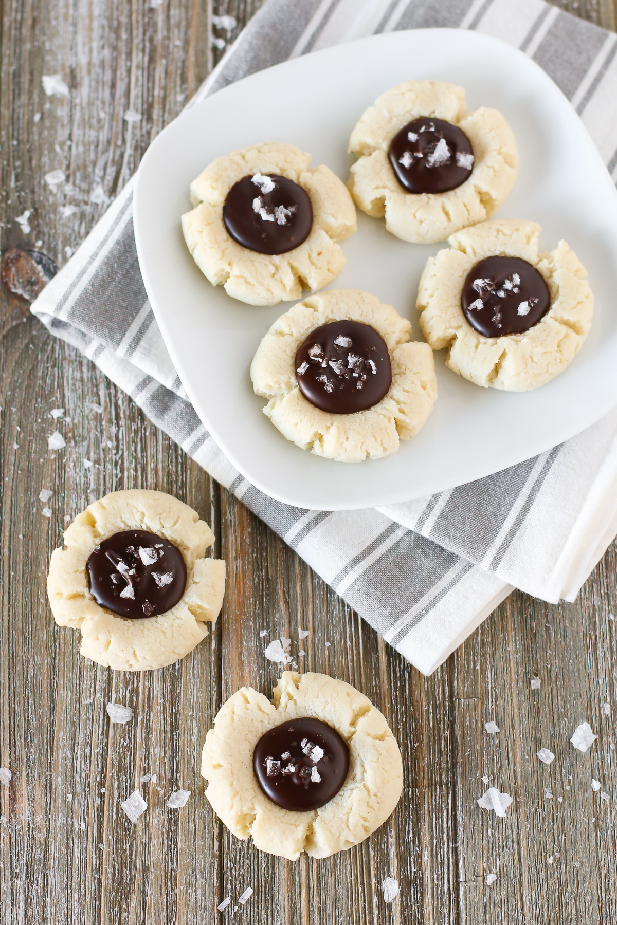 s. Soft almond thumbprint cookies, filled with a decadent chocolate ganache and topped with sea salt flakes.