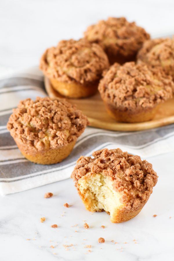Gluten Free Vegan Coffee Cake Muffins. Fluffy vanilla muffins with a cinnamon crumb topping. Perfectly paired with a cup of coffee or tea!