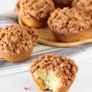 Gluten Free Vegan Coffee Cake Muffins. Fluffy vanilla muffins with a cinnamon crumb topping. Perfectly paired with a cup of coffee or tea!