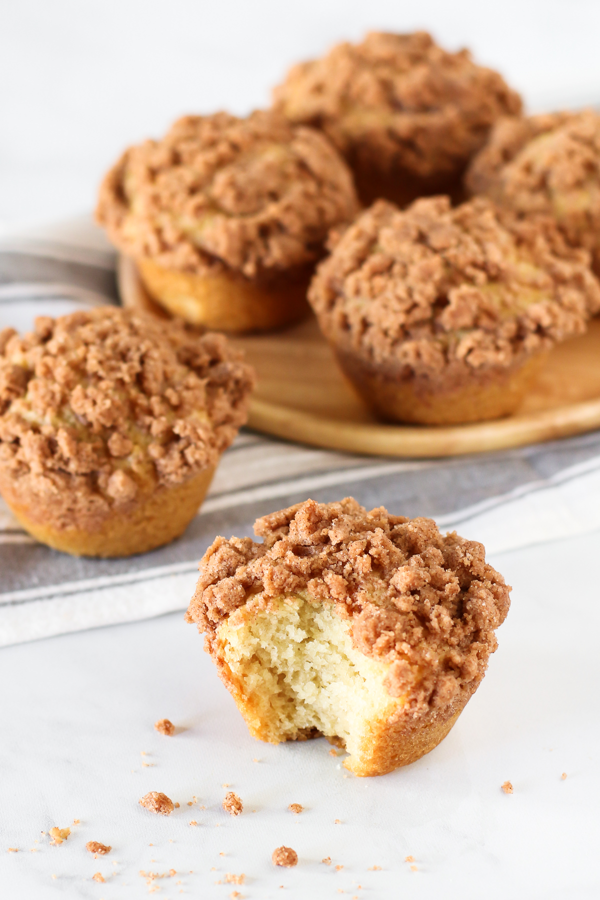 Gluten Free Vegan Coffee Cake Muffins. Fluffy vanilla muffins with a cinnamon crumb topping. Perfectly paired with a cup of coffee or tea!