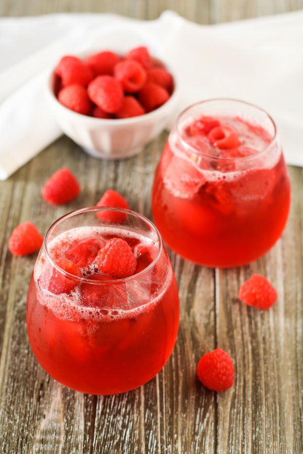 Raspberry Rosé Floats. Raspberry sorbet and sparkling rosé wine, topped with fresh raspberries. A berry sweet drink!