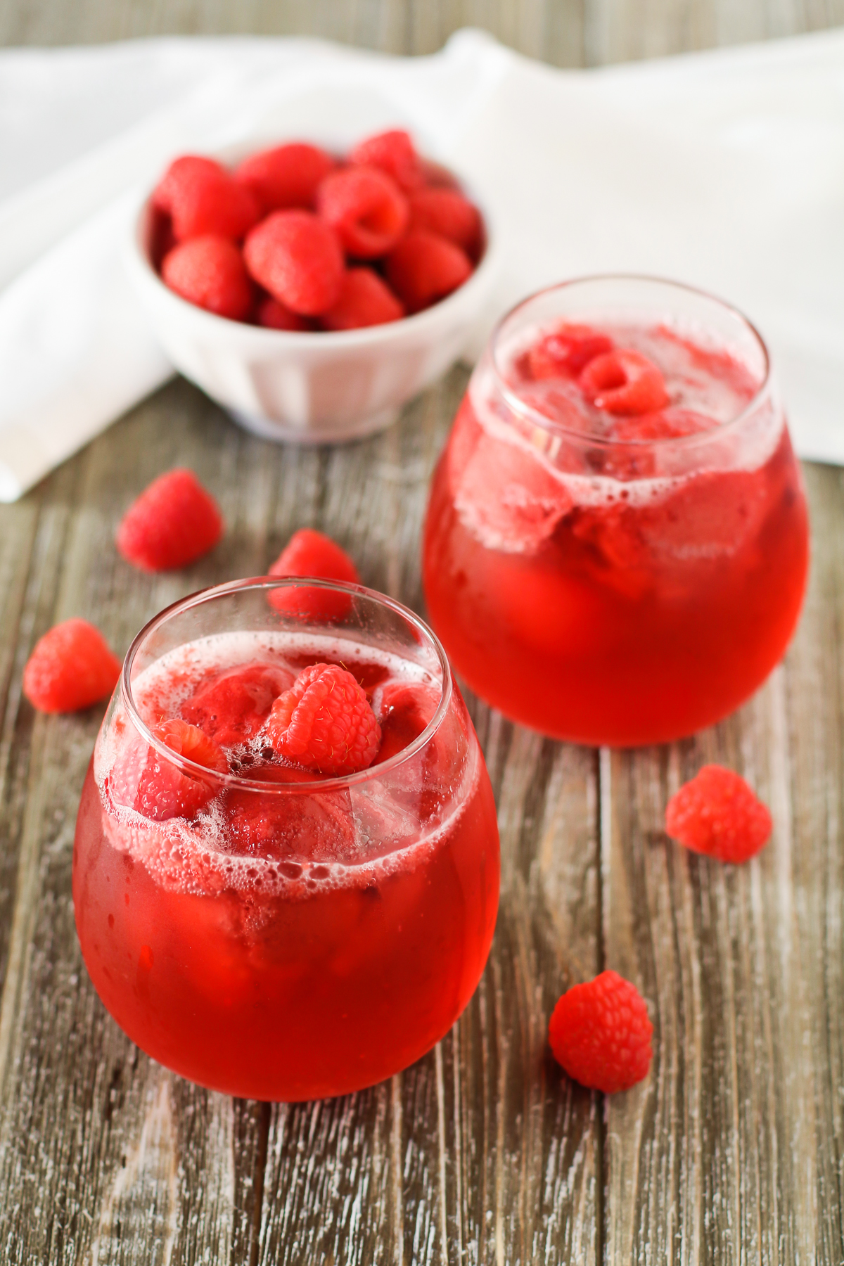 Raspberry Sorbet Rosé Floats. Raspberry sorbet and sparkling rosé wine, topped with fresh raspberries. A berry sweet drink!