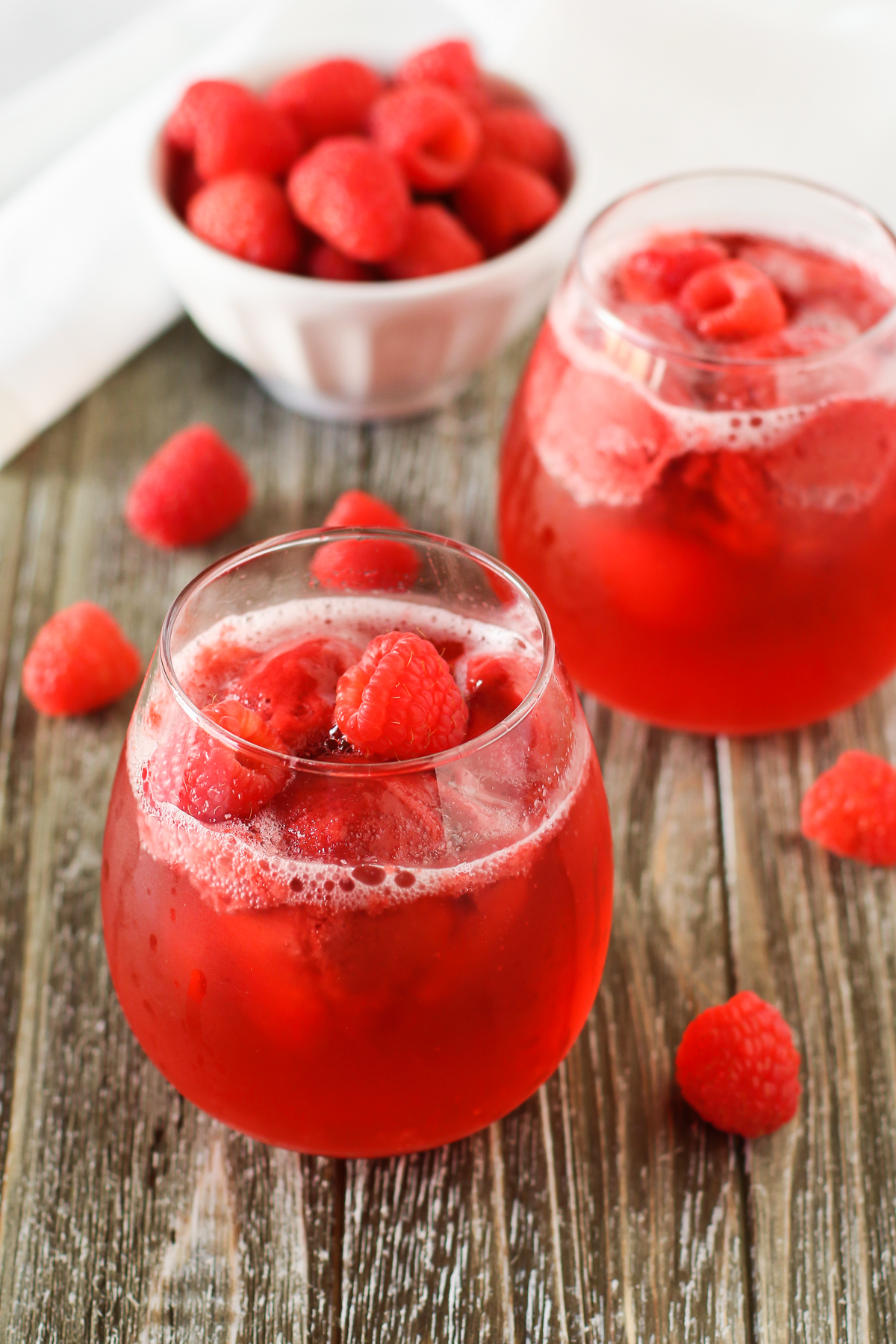 Raspberry Sorbet Rosé Floats. Raspberry sorbet and sparkling rosé wine, topped with fresh raspberries. A berry sweet drink!