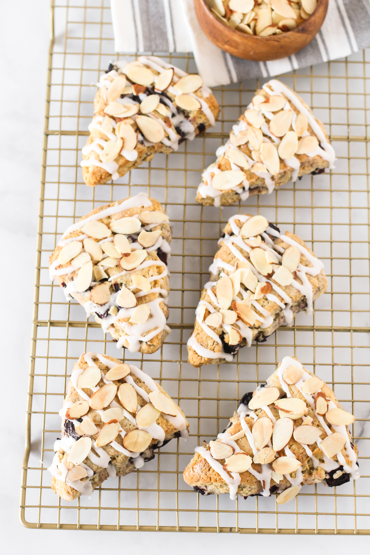 Gluten Free Vegan Cherry Almond Scones. Tender scones with black cherries. The simple glaze and toasted almonds are the perfect topping!