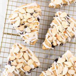 Gluten Free Vegan Cherry Almond Scones. Tender scones with black cherries. The simple glaze and toasted almonds are the perfect topping!