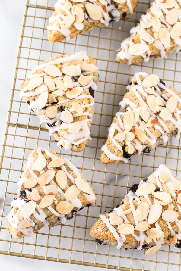 Gluten Free Vegan Cherry Almond Scones. Tender scones with black cherries. The simple glaze and toasted almonds are the perfect topping!