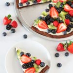 Gluten Free Vegan Brownie Fruit Pizza. Chocolate brownie crust with a cream cheese frosting, loaded with fresh fruit. A beautiful dessert pizza!