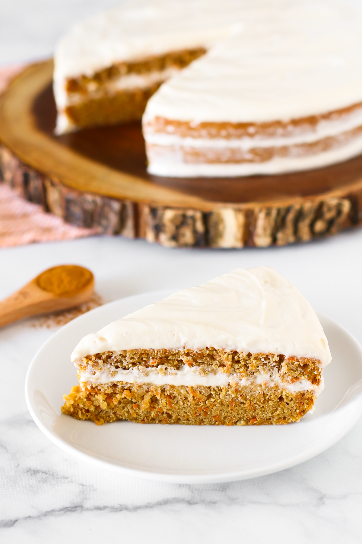 Gluten Free Vegan Carrot Cake. Layers of moist, spiced carrot cake and decadent cream cheese frosting. The classic cake made allergen free!