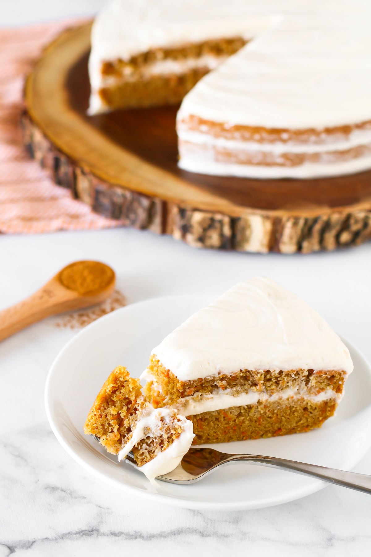 Gluten Free Vegan Carrot Cake. Layers of moist, spiced carrot cake and decadent cream cheese frosting. The classic cake made allergen free!