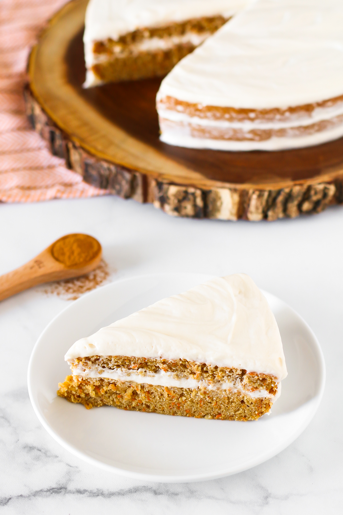 Gluten Free Vegan Carrot Cake. Layers of moist, spiced carrot cake and decadent cream cheese frosting.