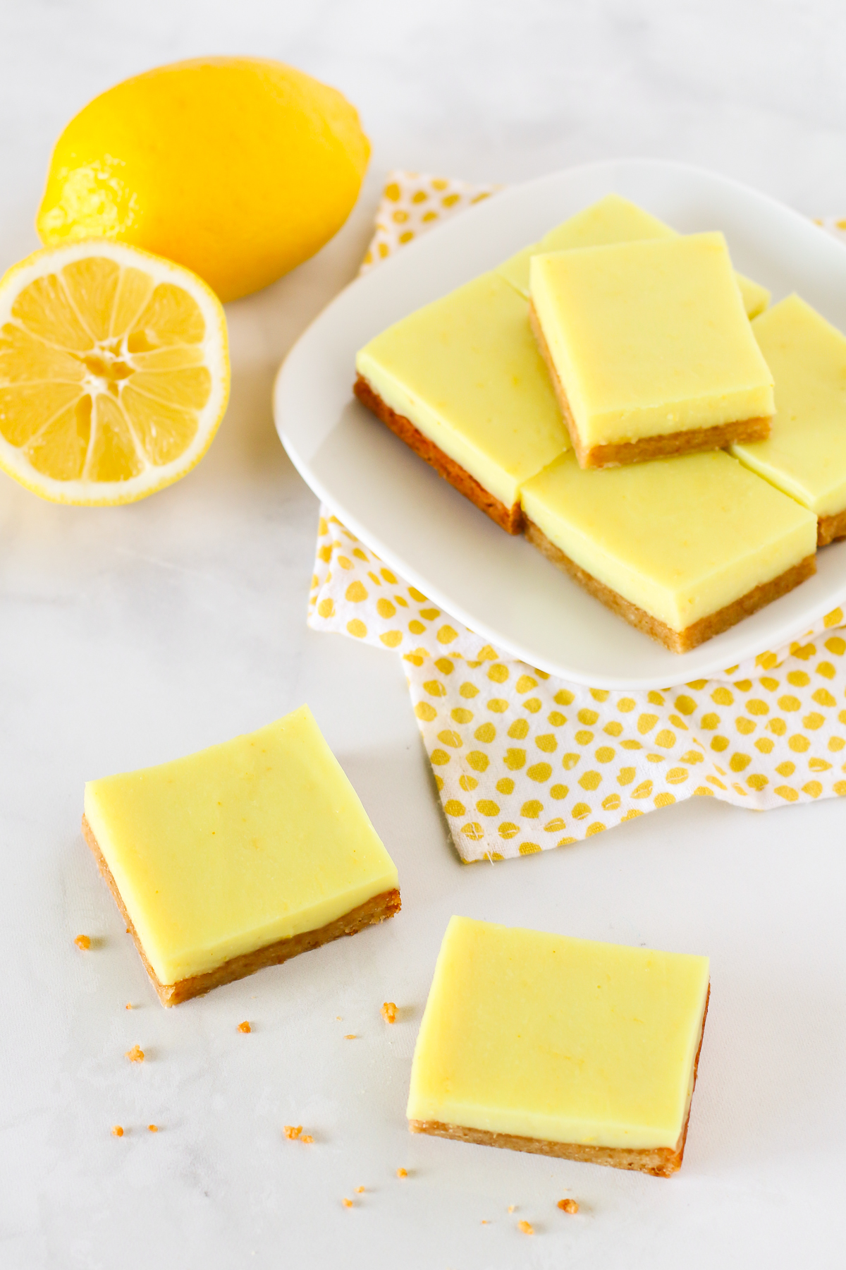 Gluten Free Vegan Lemon Bars. Chewy almond crust with a layer of creamy lemon deliciousness make these lemon bars simply irresistible!