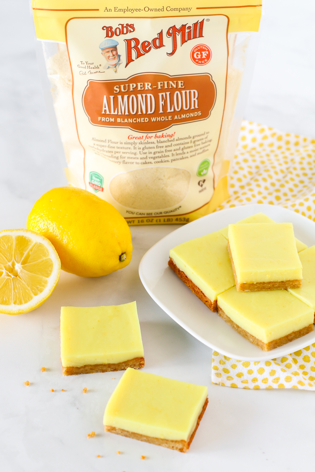 Gluten Free Vegan Lemon Bars. Chewy crust made with Bob’s Red Mill almond flour, topped with a creamy layer of lemon deliciousness. 