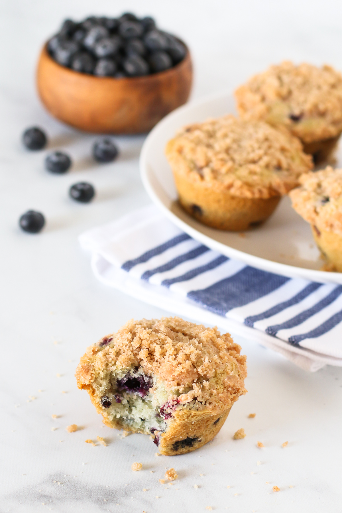 Gluten Free Vegan Blueberry Crumb Muffins. Tender muffins with sweet blueberries, with a beautiful cinnamon crumb topping.