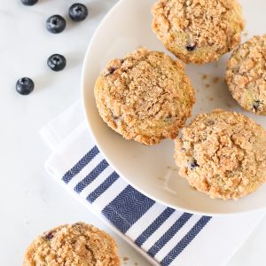 Gluten Free Vegan Blueberry Crumb Muffins. Tender muffins with sweet blueberries, with a beautiful cinnamon crumb topping.