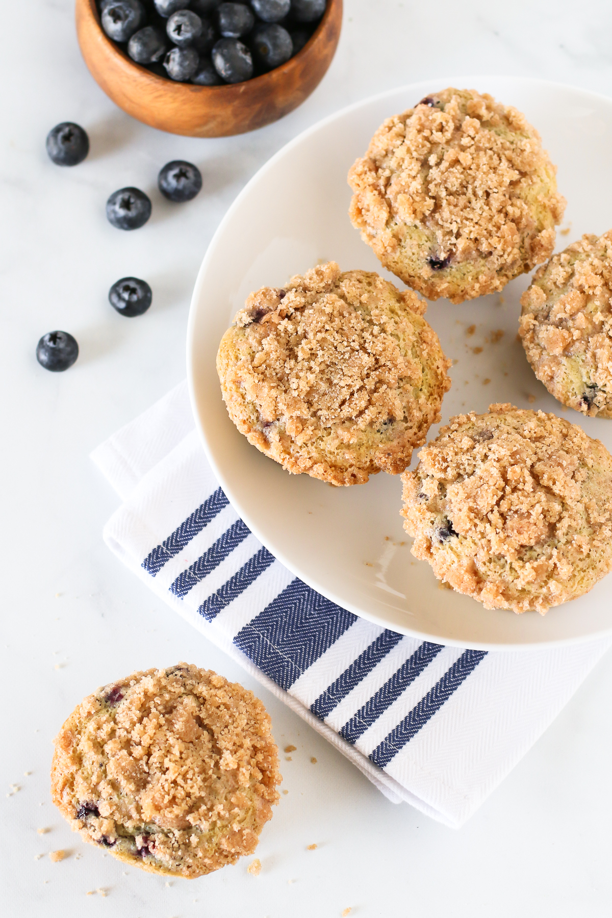 Gluten Free Vegan Blueberry Crumb Muffins. Tender muffins with sweet blueberries, with a beautiful cinnamon crumb topping.