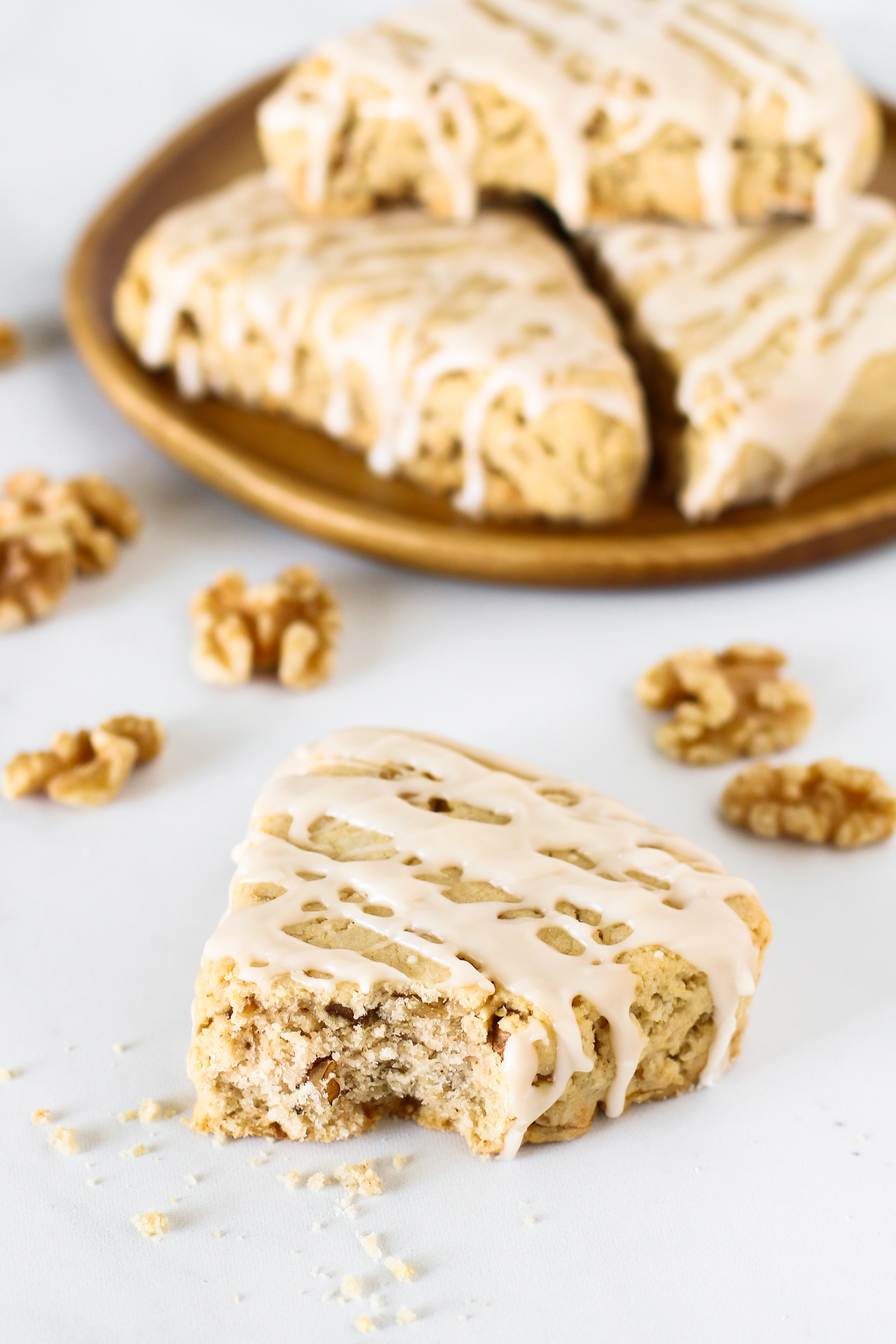 Gluten Free Vegan Maple Walnut Scones.Tender scones with toasted walnuts, covered in a drizzle of maple glaze. Just like the ones you get fresh at the bakery, only made from scratch at home.