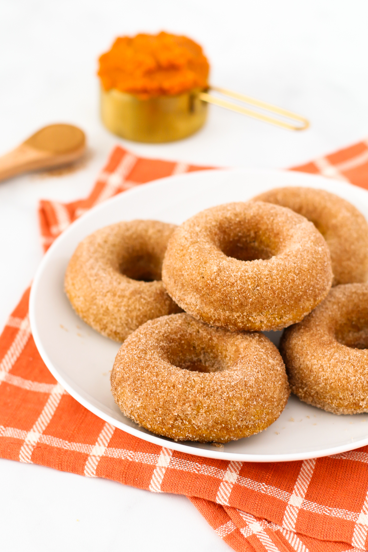 Gluten Free Vegan Cinnamon Sugar Pumpkin Donuts. Fluffy baked pumpkin donuts, covered perfectly in cinnamon sugar. 