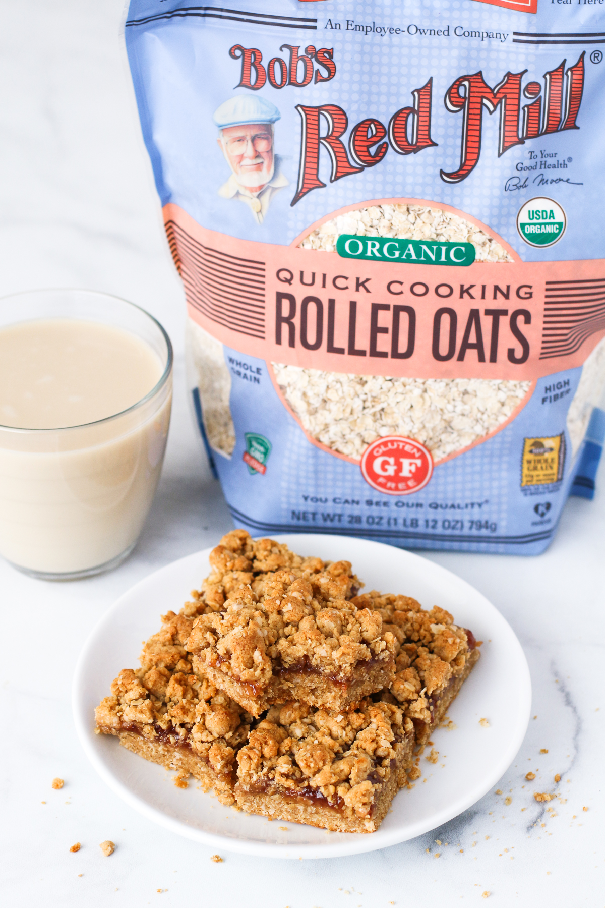 Gluten Free Vegan Peanut Butter and Jelly Oat Bars. The classic combination of creamy peanut butter and strawberry jelly in a oat crumb bar, featuring Bob’s Red Mill gluten free oats.