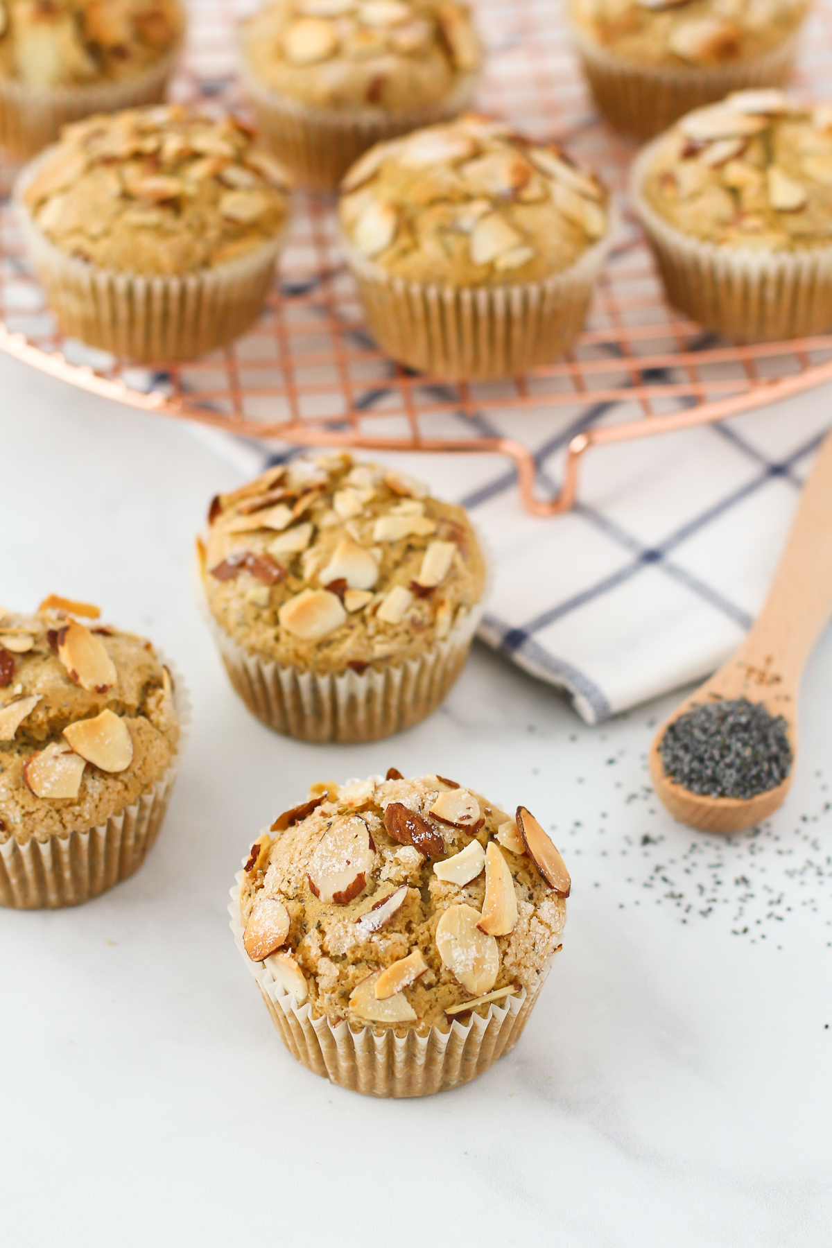 Gluten Free Vegan Almond Poppyseed Muffins. Tender poppyseed muffins, with the crunch of toasted almonds. Such a lovely morning treat!