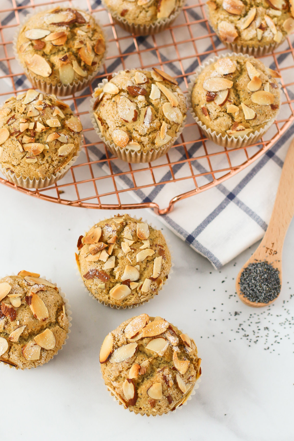 Gluten Free Vegan Almond Poppyseed Muffins. Tender poppyseed muffins, with the crunch of toasted almonds. Such a lovely morning treat!