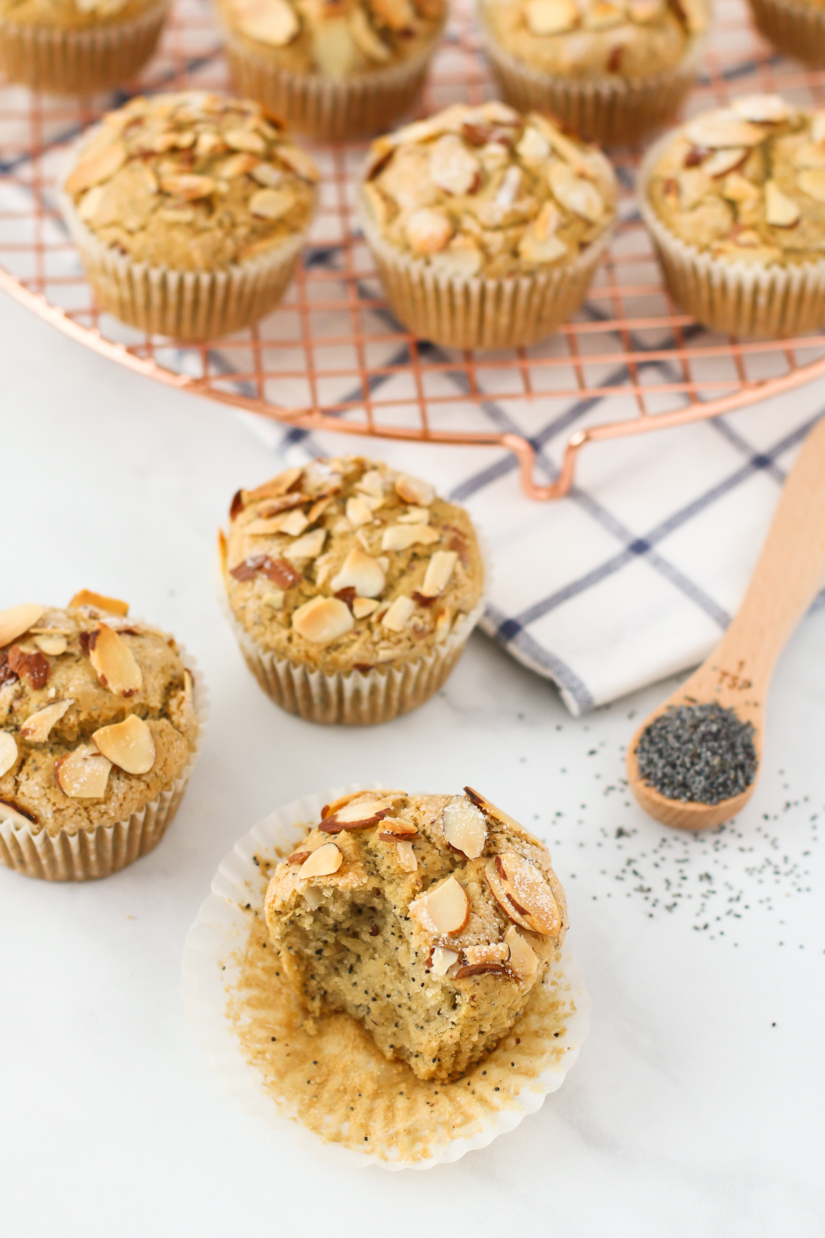 Tender poppyseed muffins, with the crunch of toasted almonds. These gluten free vegan almond poppyseed muffins are baked to perfection!