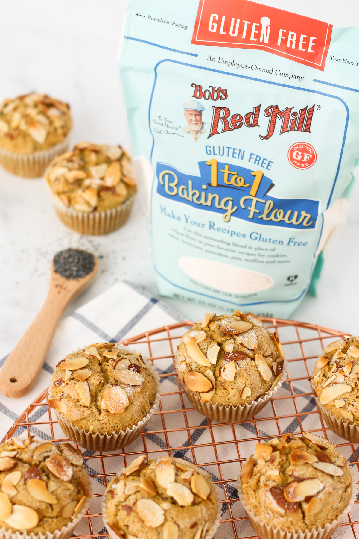 Tender poppyseed muffins, with the crunch of toasted almonds. These gluten free vegan almond poppyseed muffins are baked to perfection, using Bob’s Red Mill Gluten Free 1-to-1 Baking Flour!